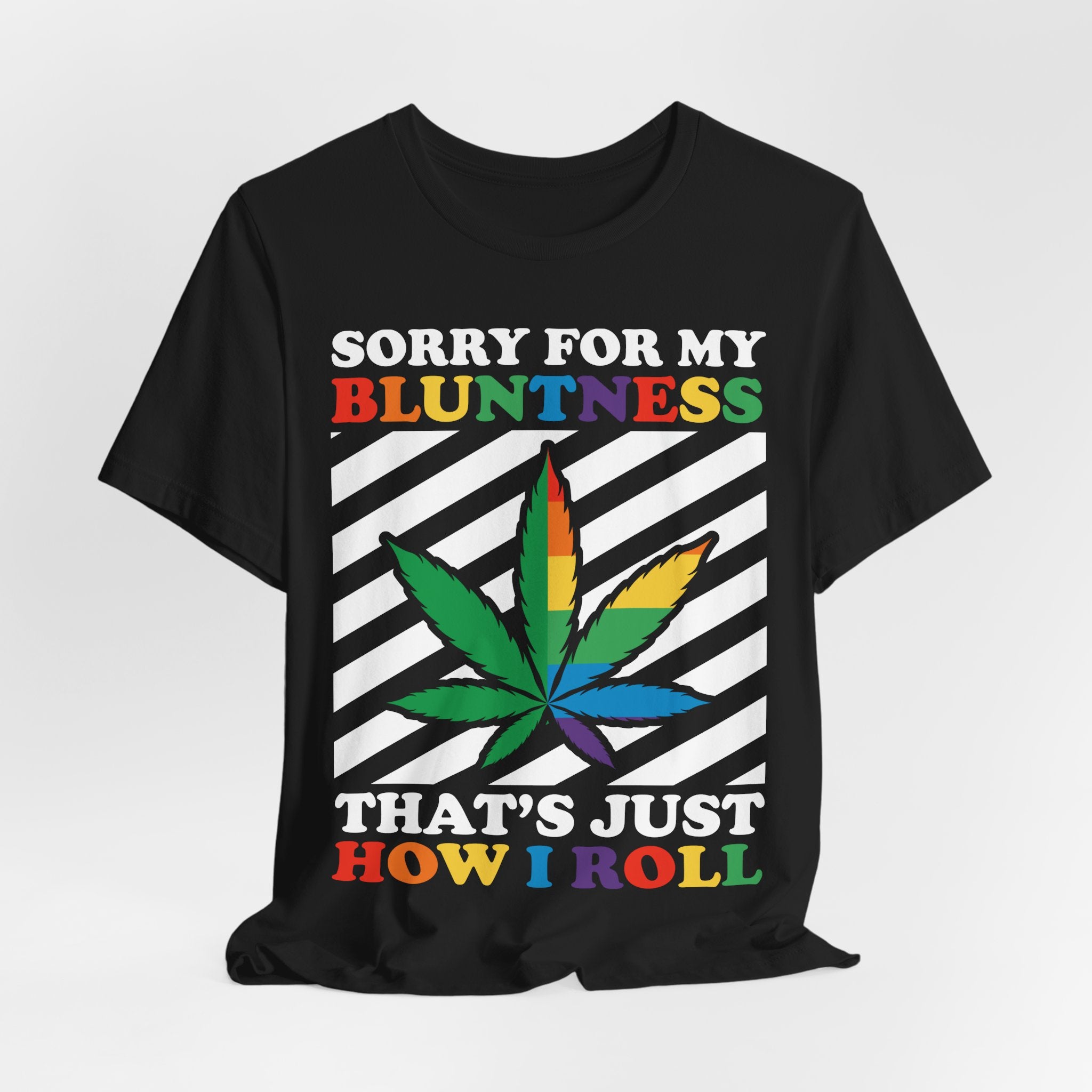 Black t-shirt with colorful cannabis leaf design and text on a white background
