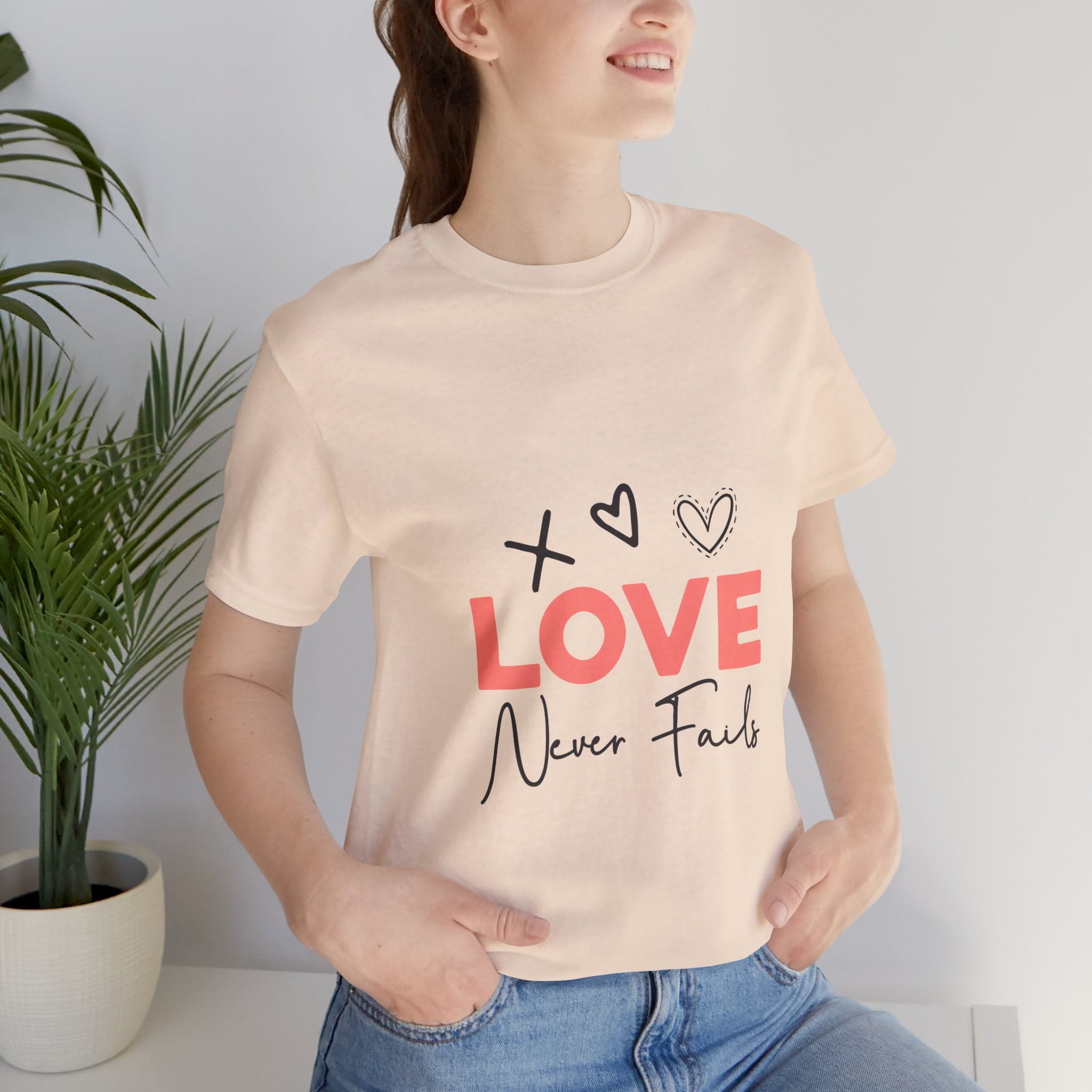 Love Never Fails T-Shirt – Inspirational Heart Graphic Tee