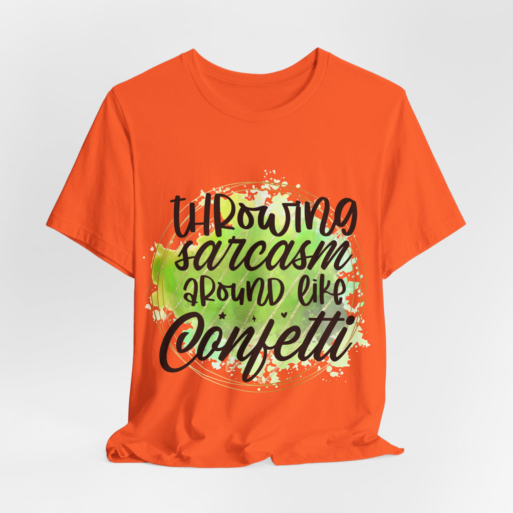 Orange t-shirt with humorous text design on a light gray background