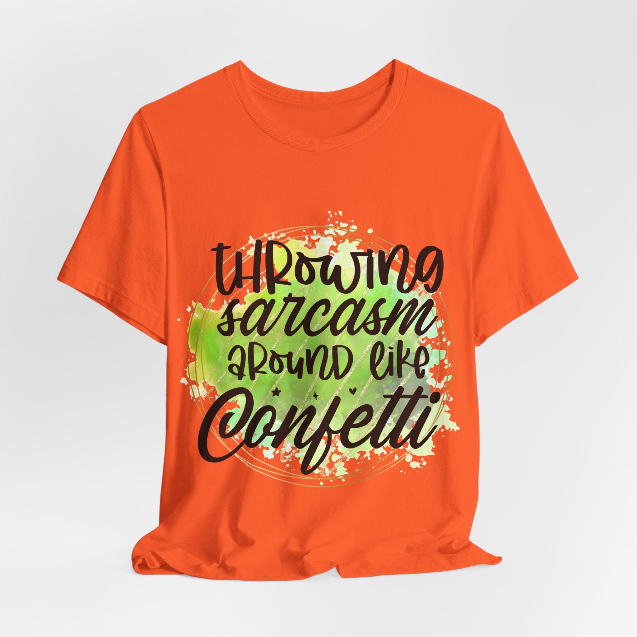 Orange t-shirt with humorous text design on a light gray background