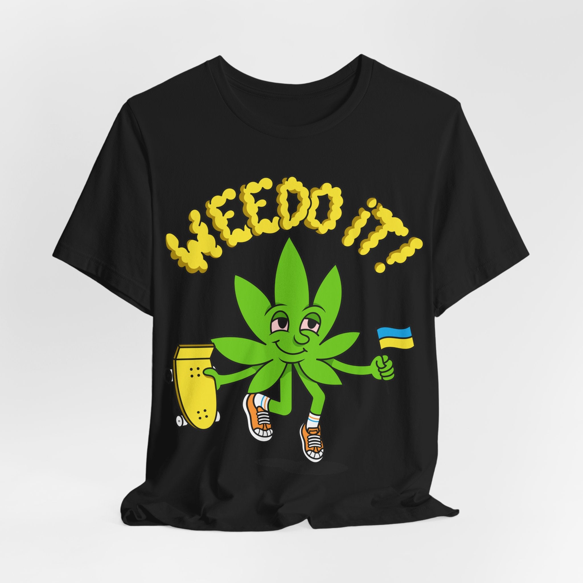 Playful Cannabis Leaf Tee — Cartoon Leaf with Flag & 'Puffs' Lettering