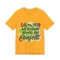 Yellow t-shirt with black text and green design on a white background