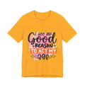 Yellow t-shirt with colorful text design on a white background