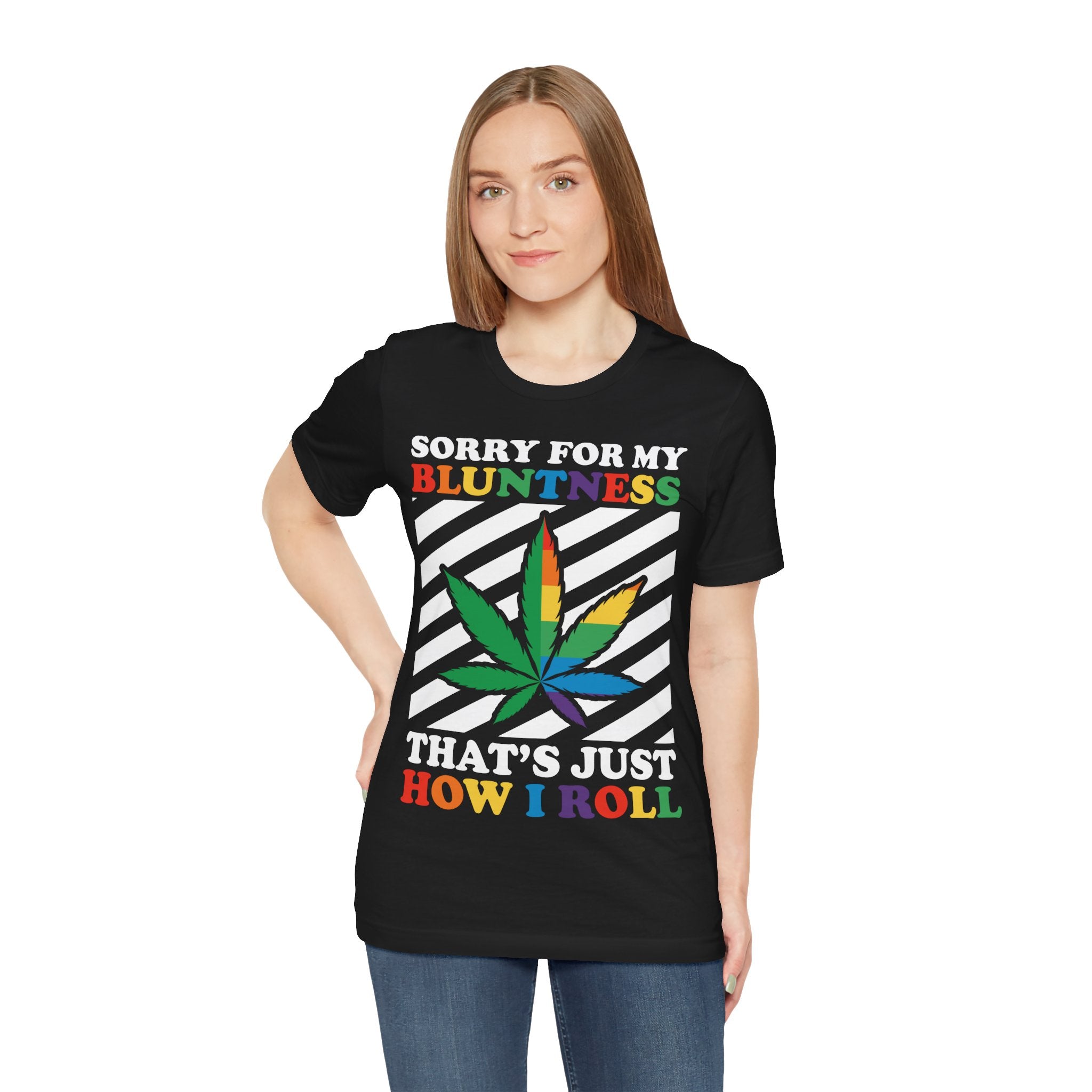 Woman wearing a black t-shirt with a colorful cannabis leaf design and text on a white background