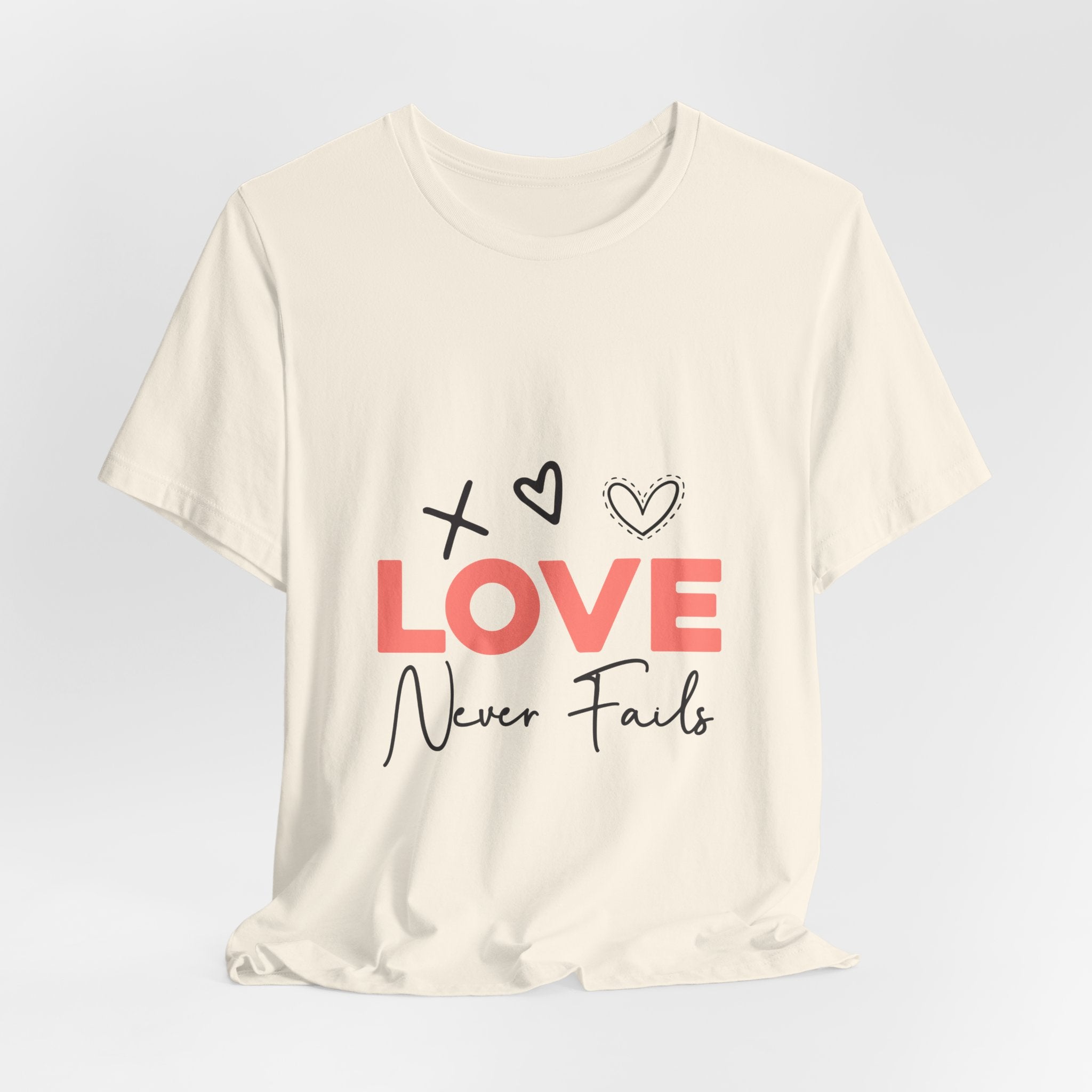 Love Never Fails T-Shirt – Inspirational Heart Graphic Tee