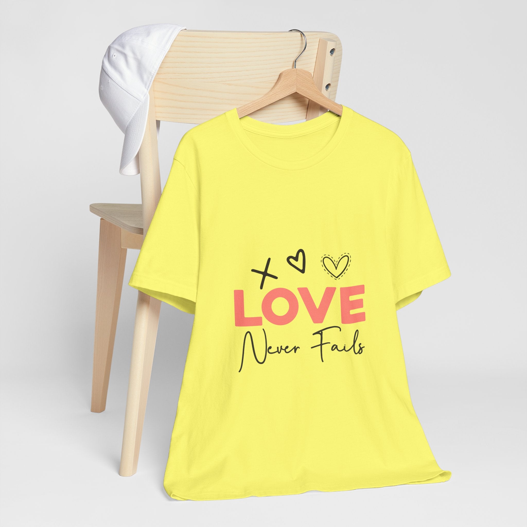 Love Never Fails T-Shirt – Inspirational Heart Graphic Tee